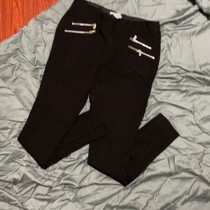 Black stretchy cropped pants with front zippers